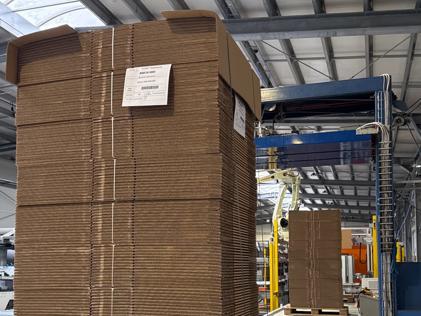Finished, labeled pallet of boxes next to the palletizing robot